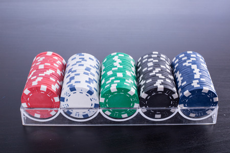 Poker chips for casino game on the table.の写真素材