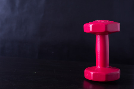 Dumbbell for building your body with black background.の写真素材