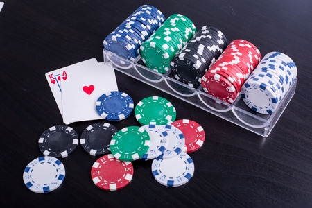 Poker chips for casino game on the table.