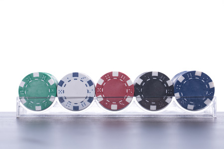 Poker chips for casino game on the table.