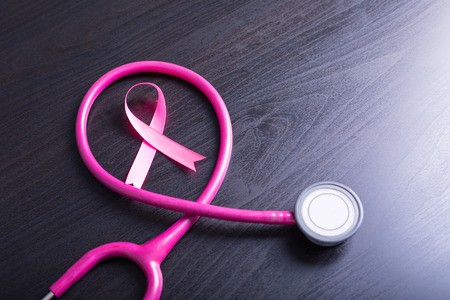 Breast cancer awareness pink sign symbol for help illness people with stethoscope.の写真素材