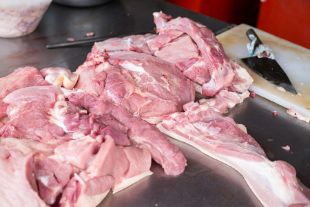 Pork meat raw material chop piece slicing for customer.の写真素材