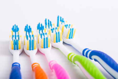 Colorful tooth brushes with white background.