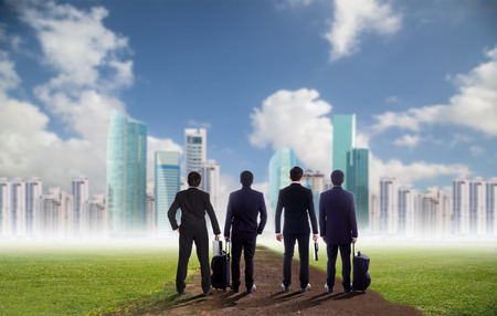 Businessman standing for going forward to investment city area for success his target in new cityの写真素材