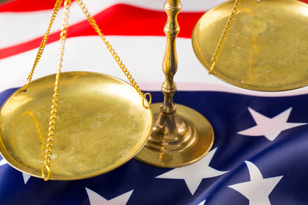 Justice of scale with American flag