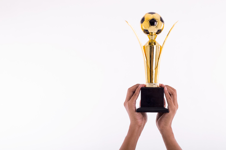 Award football Trophy for winner achievement after win competition with isolated white background.の写真素材