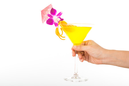 Woman holding cocktail lemon beverage glass for your drink isolated with white background.の写真素材