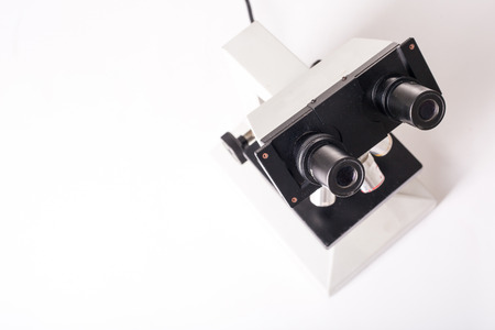 Microscope machine for research experiment with white background.の写真素材