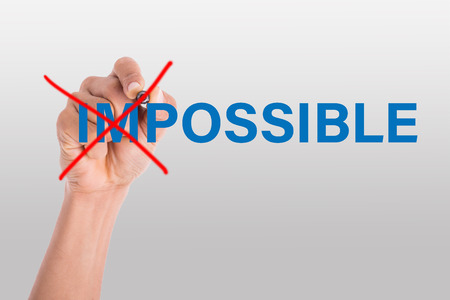 Writing cross word impossible to possible solution business idea.の写真素材