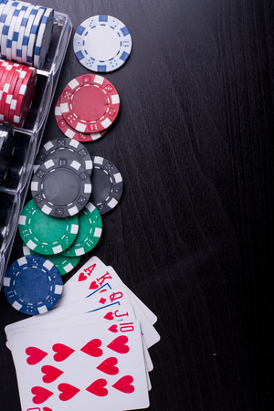 Poker chips for casino game on the table.