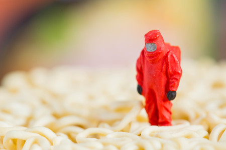 Protective suit science  people inspecting food and fruit with food danger concept.の写真素材