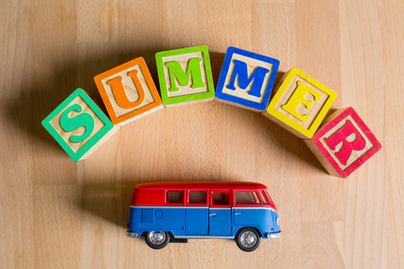 Summer cube text with toy van for your vacation.の写真素材