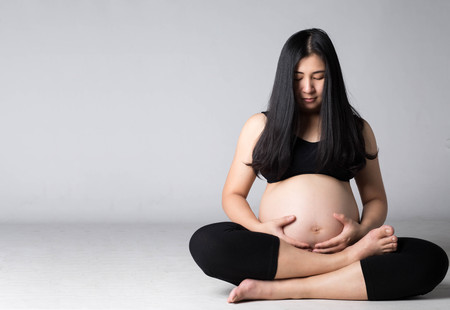 Pregnant Asian woman in studio .の写真素材
