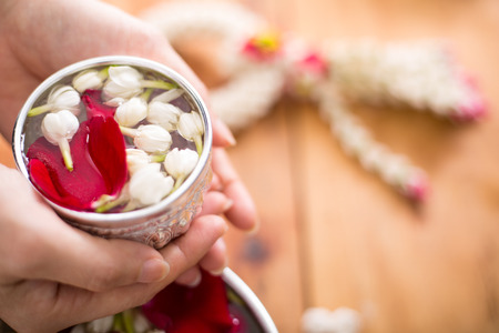 Songkran festival, Thai people prepare water perfume with flower on Thailand New Year.の写真素材