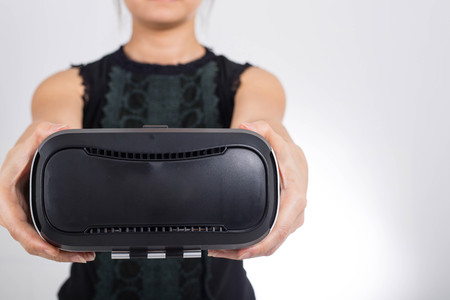 Holding VR virtual reality headset for your watch with smartphone.