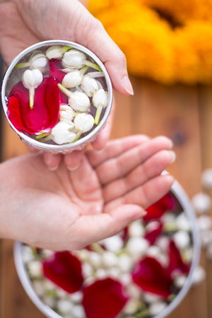 Songkran festival, Thai people prepare water perfume with flower on Thailand New Year.の写真素材