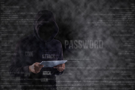 Hacker stand and search for hack your security system.の写真素材