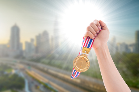 The winner holding award one medal to show with his team take reward success business.の写真素材