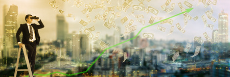 Businessman vision looking forword with binoculars for grow and money income to your business.の写真素材