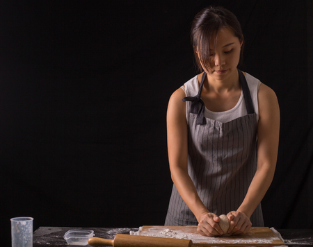 Kneading dough prepare for breafast food in the kitchen room.の写真素材