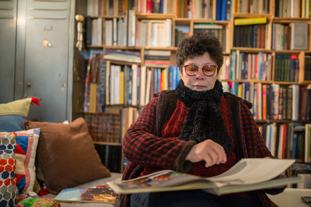 Asian senior people reading a book in the room.の写真素材