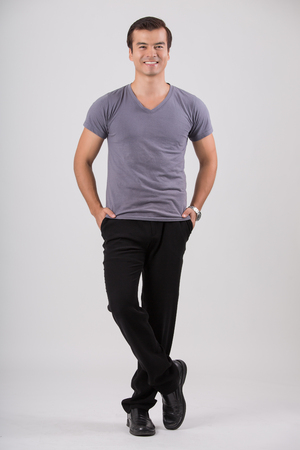 Casual man full body with white background.の写真素材