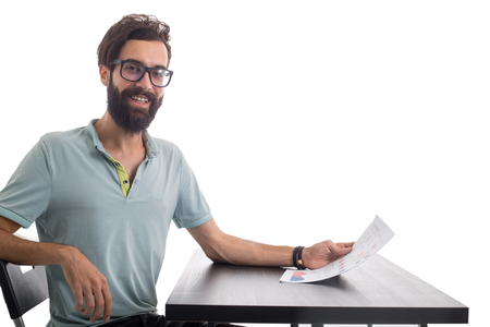 Casual businessman looking at the graph and smile with white background.の写真素材