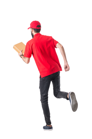 Delivery man holding box and running for send to customer with isolated white background.の写真素材