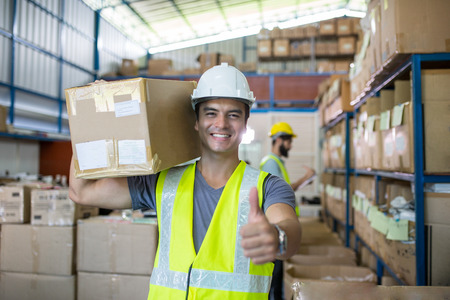 Warehouse worker checking stock products for prepare to packing to customer.の写真素材