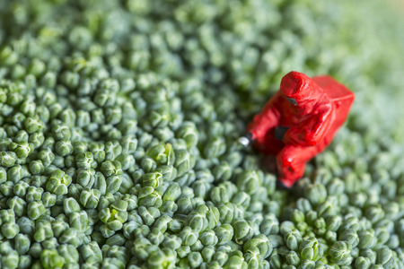 Dangerous food scientist with red protect suit servey food area.の写真素材