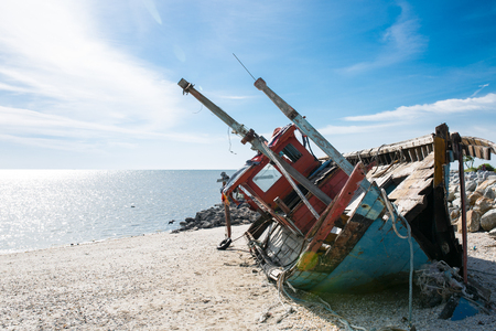 Abandoned boat fisherman on the beach ,Malaysia.の写真素材