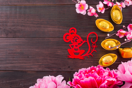 Year of  rat red paper on the wood table.の写真素材