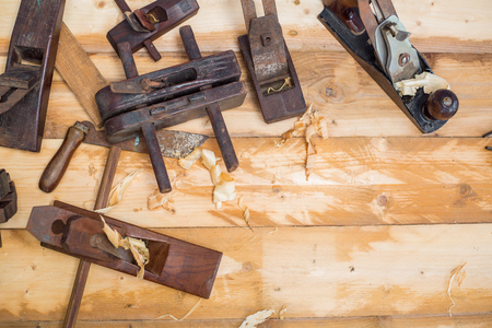 Wood carpenter working timb furniture in room workshop.の写真素材