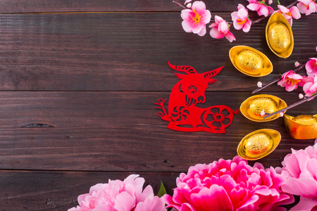 Year of  Goat  red paper on the wood table.の写真素材