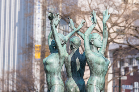 Three dancing bronze in front of Odari Park where are doing Snow festival every year.の写真素材