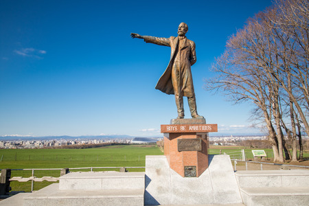 SAPPORO ,JAPAN - April 27 ,2016 :Prof.William S.Clark statue monument front of University and text with Boys.be Ambitious in Hitsujigaoka Observation Hill view.のeditorial素材
