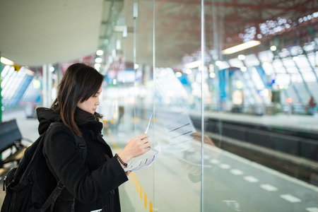 Asian people open planning for check and find map in Train station.の写真素材