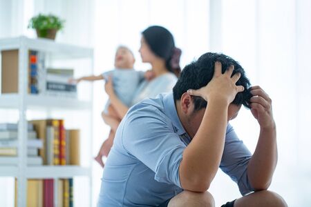 Employer dismissal and worried stay at home after company terminated employee.の写真素材