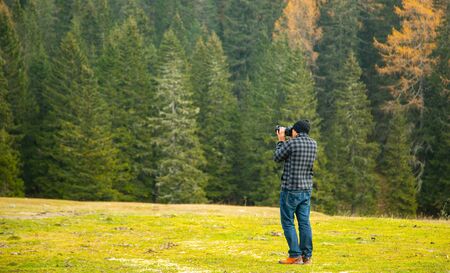 Photographer holding DSLR camera for take a picture in Bolzano ,Italy.の写真素材