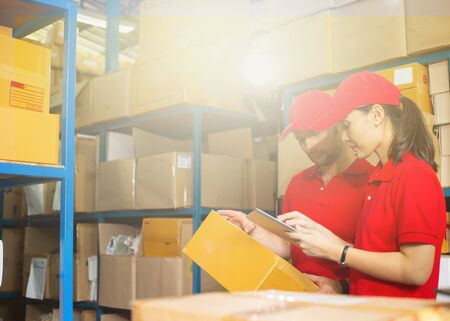Two people working together for check tracking number 
to delivery to customer.の写真素材