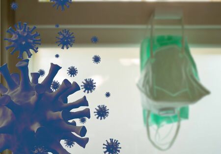 Mask protective corona virus or Covid - 19 hang on the windowの写真素材