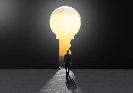 Success businessmen walking to key success holes for think of strategy and ideas for creating their business investment. Leadership challenges in life.Freedom development.の写真素材