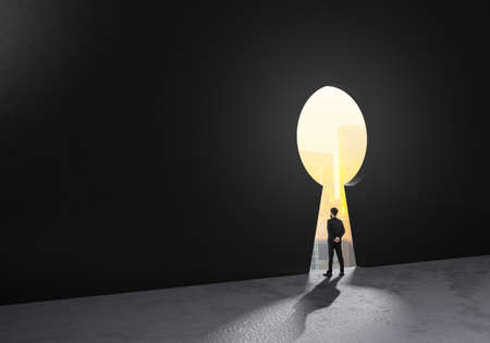 Success businessmen stand and looking key success holes for think of strategy and ideas for creating their business investment. Leadership challenges in life.Freedom development.の写真素材