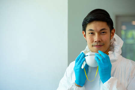 Asian medical PPE professional technician staff open maskの写真素材