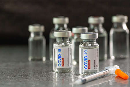 Syringe  prepare for inject dose to people prevent covid 19. Doctor arrange  vaccine to  patient in...