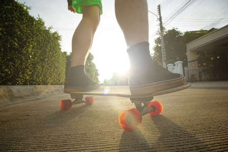 Surfskate player play skateboard exercise in the outdoor.Asian lifestyle for plays extream sports.Freestyle dynamic action skateboarding in the street.の写真素材