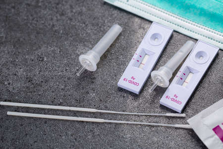 Rapid Antigen Test kit for check coronavirus result is negative result with report document.Covid-19 Ag with nasal rapid test.Healthy fast checking virus disease infection.の写真素材