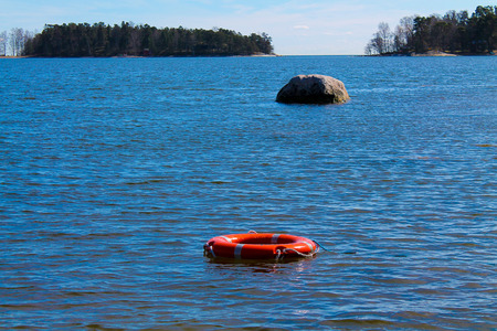 A life ring floating in the waterの写真素材