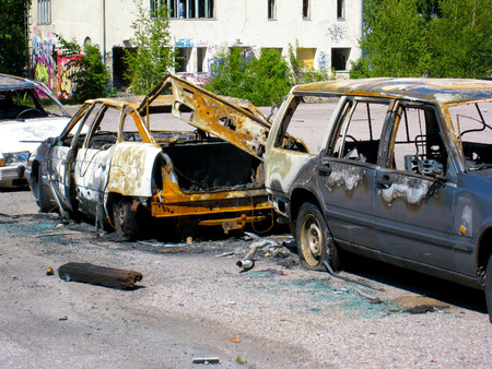Burned and destroyed cars on the street in an old harbour area of Helsinki, Finlandのeditorial素材