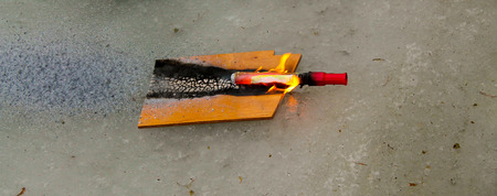 A hot emergency flare burning through material in an exercise